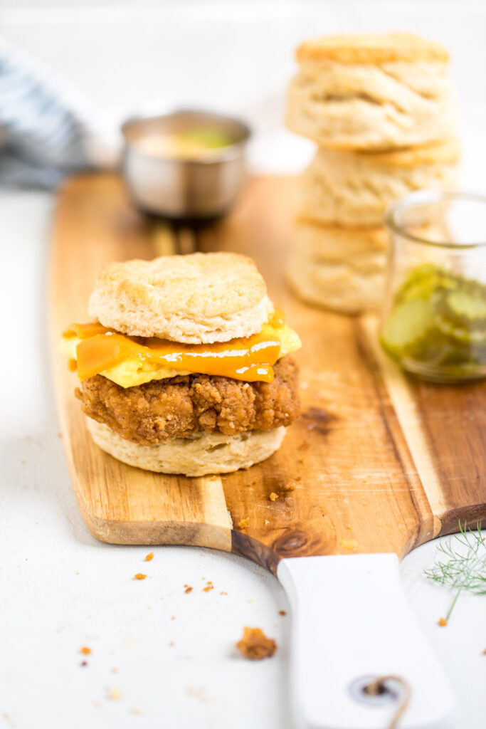 A single Copycat Chick-fil-a Vegan Chicken biscuit on a cutting board.