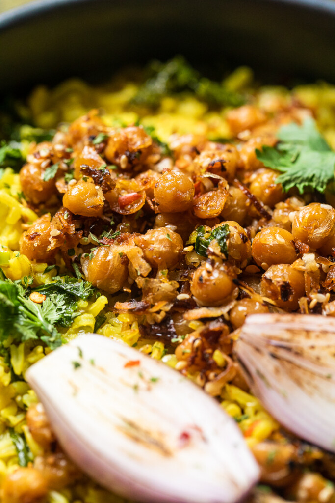 A close up of creamy coconut rice with spiced chickpeas.