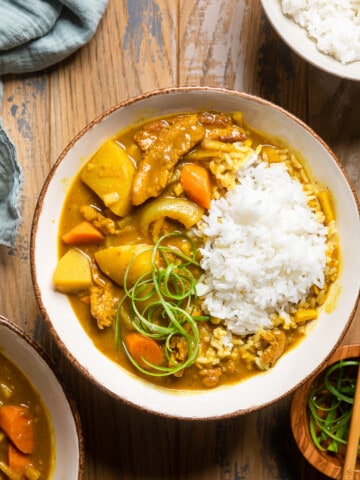 vegan Japanese curry in a cream colored bowl.