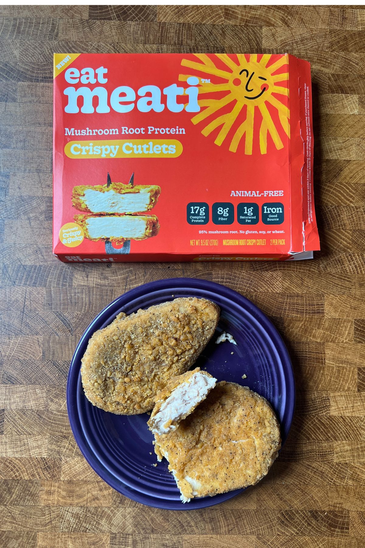 meati foods crispy cutlets cooked on a plate and the package beside it.