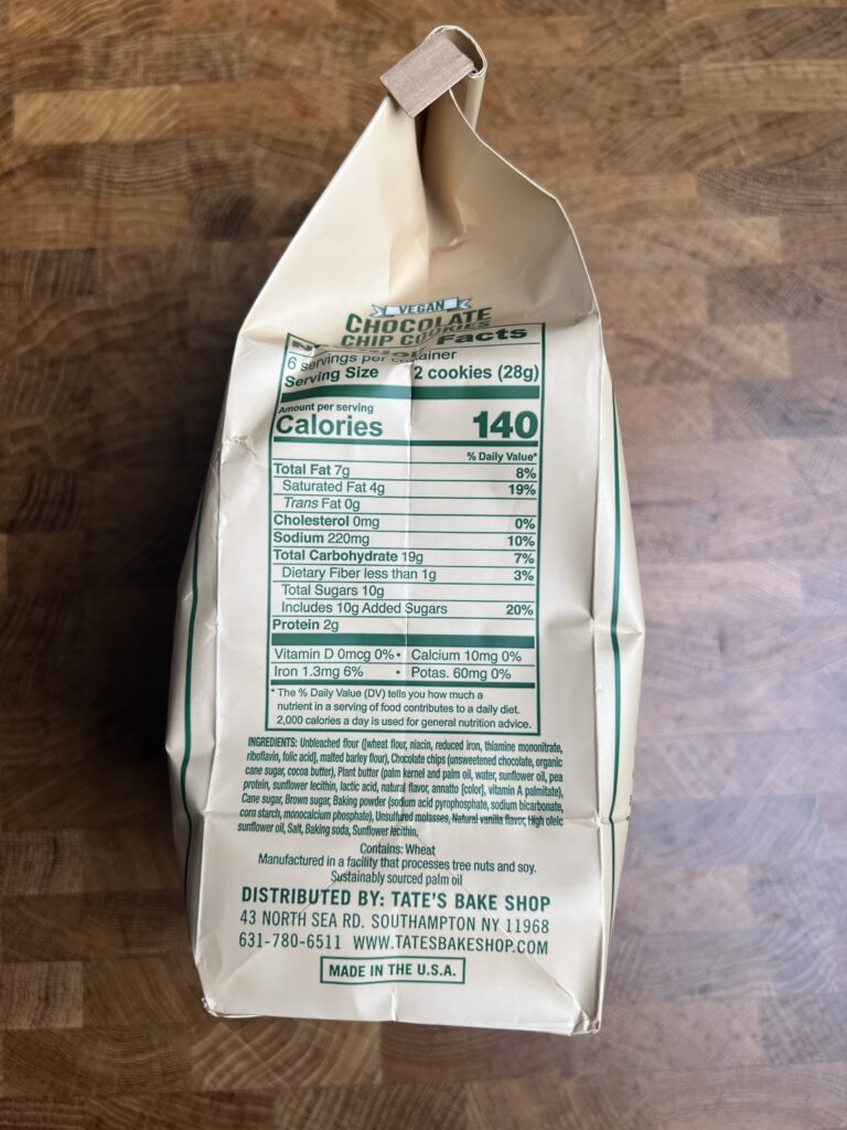 A bag of Tates vegan chocolate chip cookies with nutrition facts.