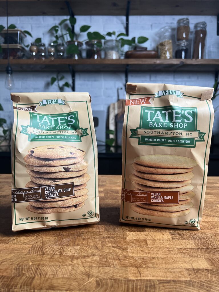 A bag of Tates vegan chocolate chip and vegan vanilla maple cookies.