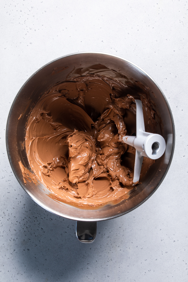 chocolate vegan frosting blended together in a bowl. 