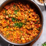 vegan sweet potato stew in a skillet on a tablescape.